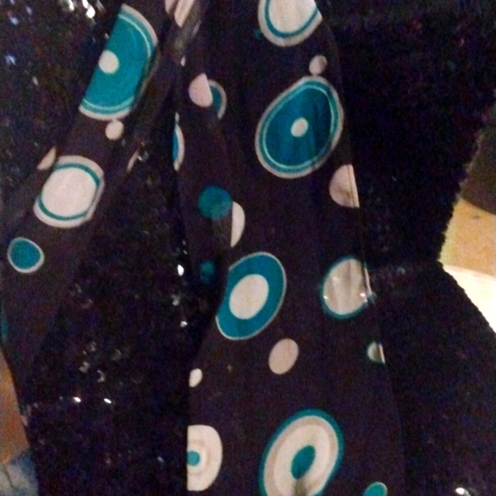 Black with teal and white round bubble like dots